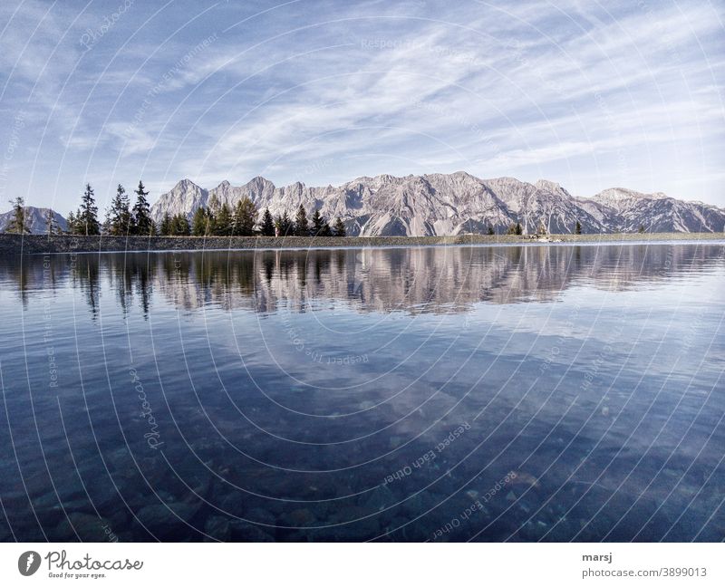 Dachstein massif reflected in a mountain lake reflection Panorama (View) Peak Moody Alps Rock Mitterspitz gate Autumn Clouds Sky Mountain Mountaineering Nature