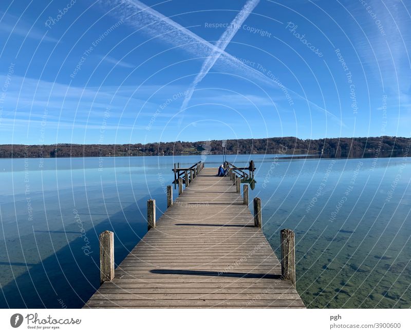 What cross in the sky? Clouds Lake Lake Starnberg Footbridge condensation strips Bavaria vacation Autumn Break To go for a walk bathe be afloat Water