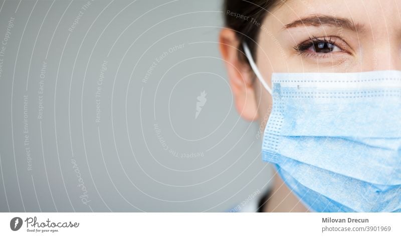 https://www.photocase.com/photos/3901969-close-up-of-female-uk-nhs-ems-doctors-face-wearing-blue-ppe-surgical-protective-mask-covid-19-coronavirus-disease-global-pandemic-outbreak-deadly-sars-cov-2-epidemic-copy-space-on-left-side-of-frame-photocase-stock-photo-large.jpeg
