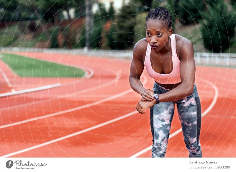 Athlete sprinter watching the clock while running control time timing race competition athlete athletics competitive ready line beginnings compete competitor