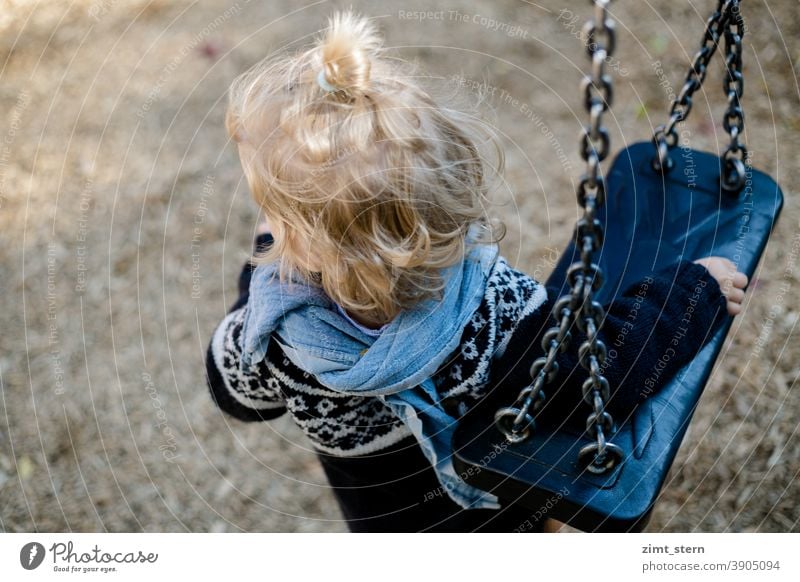 Child with swing on the playground Playground Swing Introverted Waldorf children's clothing Infancy Playing Lonely sad by oneself contented Observe