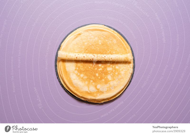 Homemade french crepes above view on a purple background. baked bakery blini breakfast comfort food cuisine cut out dessert dinner eat flat lay fresh gourmet