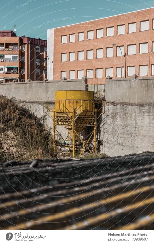 Old yellow industrial water tank. water tower city structure shadows building abandoned outdoor old urban architecture Deserted exterior Building factory nobody
