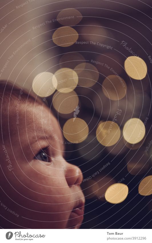 Twinkling lights, profile picture of baby in background the bokeh of twinkling lights Baby portrait Light (Natural Phenomenon) Child Infancy Colour photo Cute