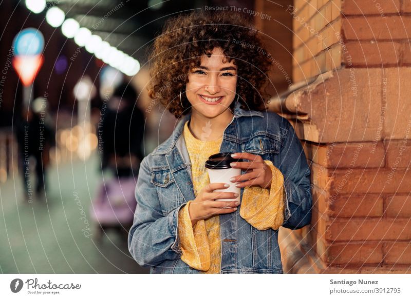 Young Girl With Short Hair Portrait cup of coffee curly hair caucasian portrait looking at camera smiling street woman young expression front view one person