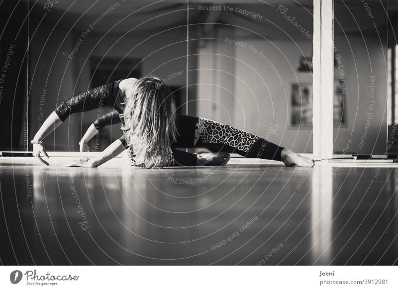 Dance training of a woman in dance studio | reflection in background in black and white Woman gymnastics Relaxation Feminine Sun Silhouette Light Sunlight