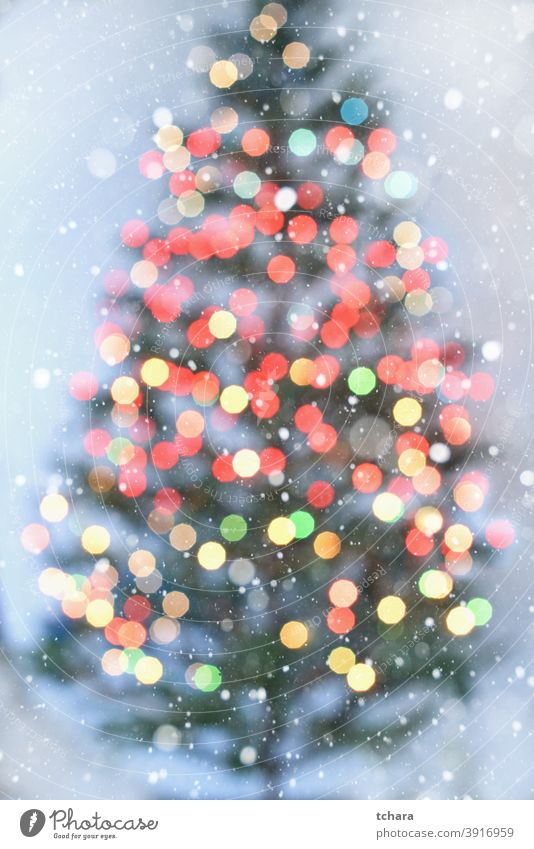 Blurred Christmas tree with colorful lights on white background bokeh Public Holiday Abstract Light Christmas decoration Bright defocused Design blurriness