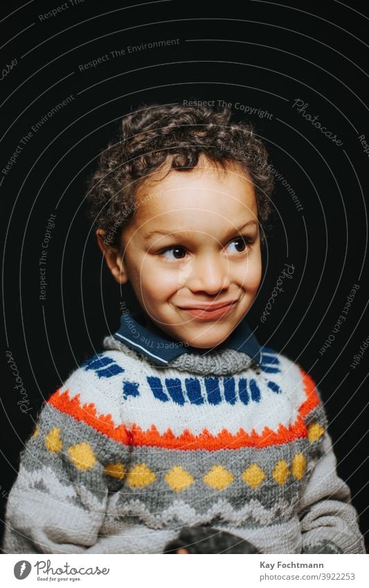 Download Studio Portrait Of Cute Black Boy Smiling A Royalty Free Stock Photo From Photocase