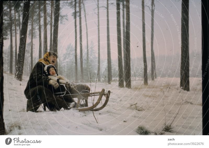 two-seater Girl Child Infancy Nature Scan Slide Analog Retro Winter Woman Mother Family & Relations Domestic happiness Winter vacation Forest Sledding Sleigh