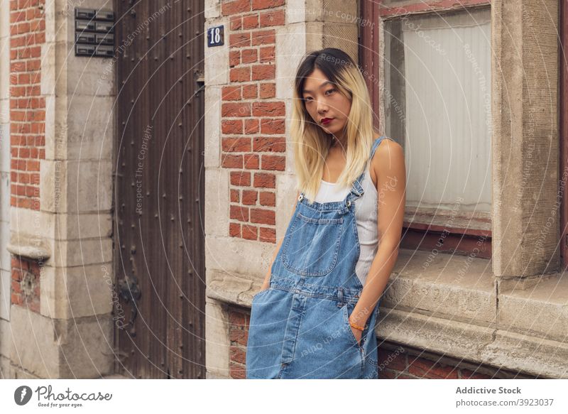 Casual Hipster Style Young Woman Portrait. Girl Standing Near the Window in  Full Growth Stock Photo - Image of funky, female: 144975338