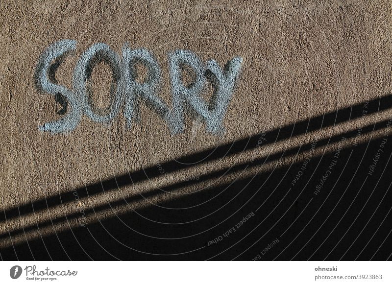 Sorry Graffiti Wall (building) Facade Characters Letters (alphabet) Typography Exterior shot Wall (barrier) Deserted Youth culture Street art Trashy sorry