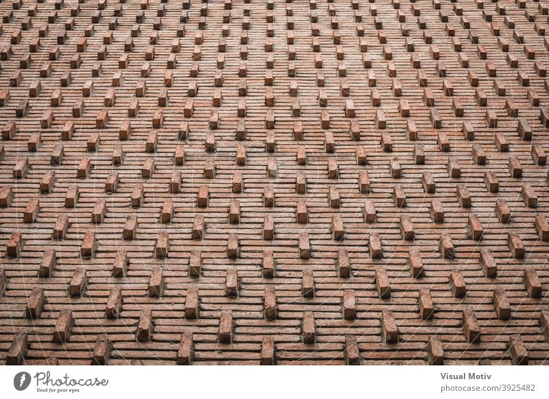Background of an ornamental red brick wall from early 30s bricks background abstract texture pattern architecture design old brown surface detail solid rows