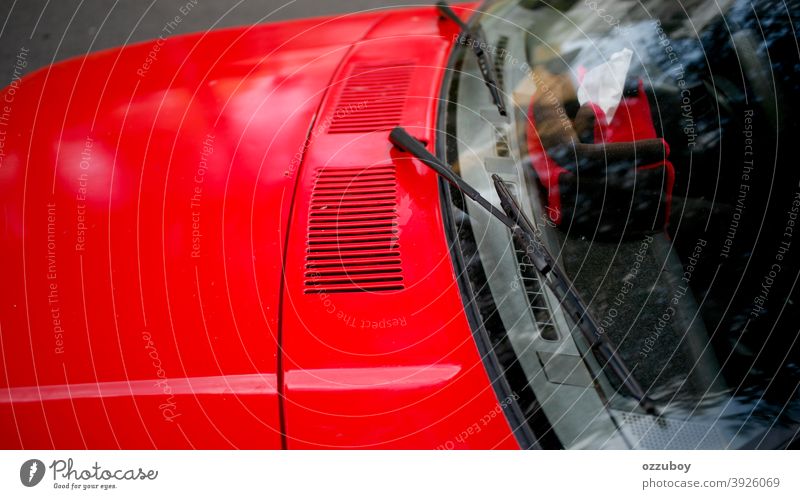 wiper on red car transportation glass outdoors horizontal automobile part vehicle windshield window windscreen driving hood luxury shiny abstract mirror