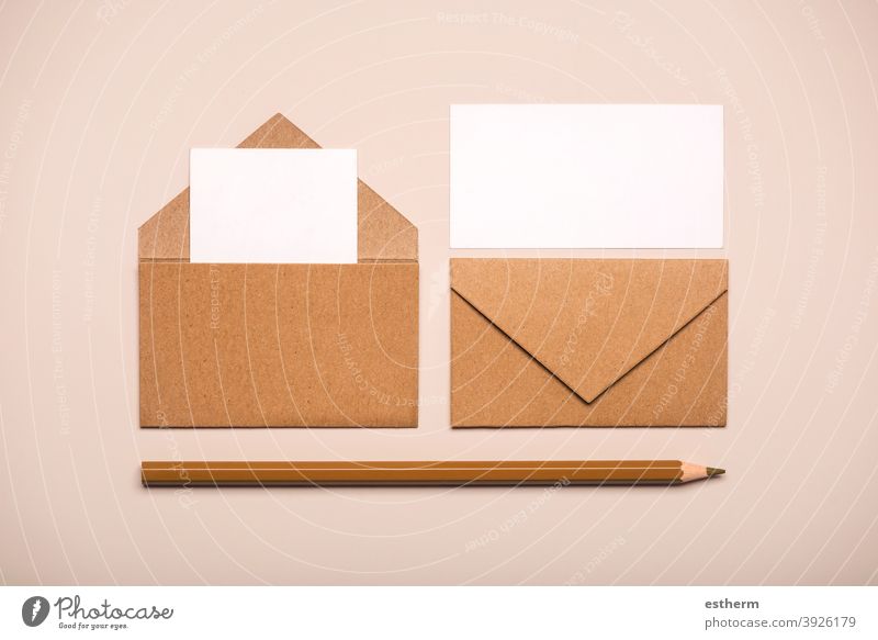 Brown paper envelopes with white cards and brown pencil letter message copyspace copy space mock-up package send cover mock up flyer page post communication