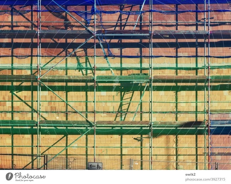 Sprightly Scaffold Building House (Residential Structure) Scaffolding Town Construction site Detail Exterior shot Contrast Sunlight Shadow Light Firm Long shot