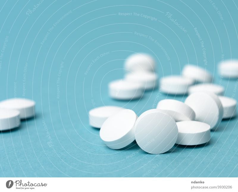 White Pills Background   3930206 White Round Pill For Health Care Medical Treatment Blue Background Photocase Stock Photo Large 