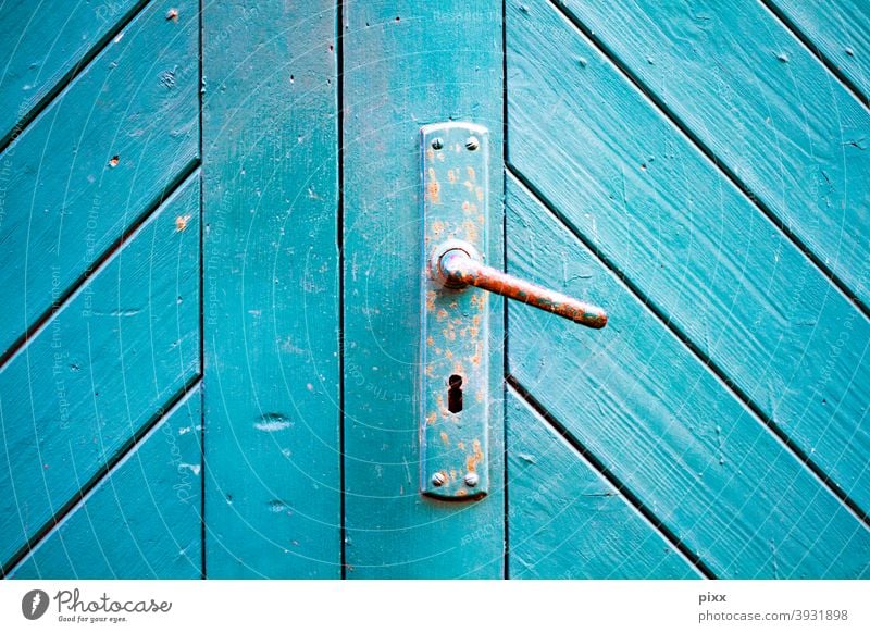 Wooden gate turquoise with door handle Closed Turquoise Blue Keyhole Front door Entrance Goal locked caginess Rust rusty Diagonal slats Colour Redecorate