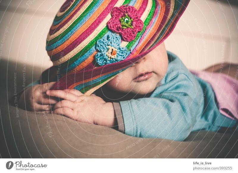 in pose Beautiful Feminine Baby 1 Human being 0 - 12 months Lie Cute Hat Subdued colour Interior shot Portrait photograph