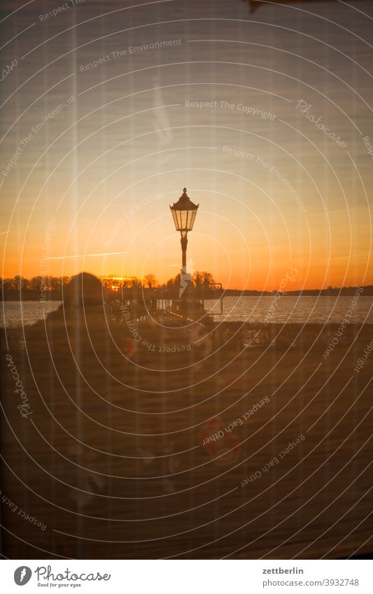 Lake Tegel with sunset as a mirror image Berlin Body of water Havel tegel harbour bank surrounding area Water water level Surface of water Sky Beach Sun