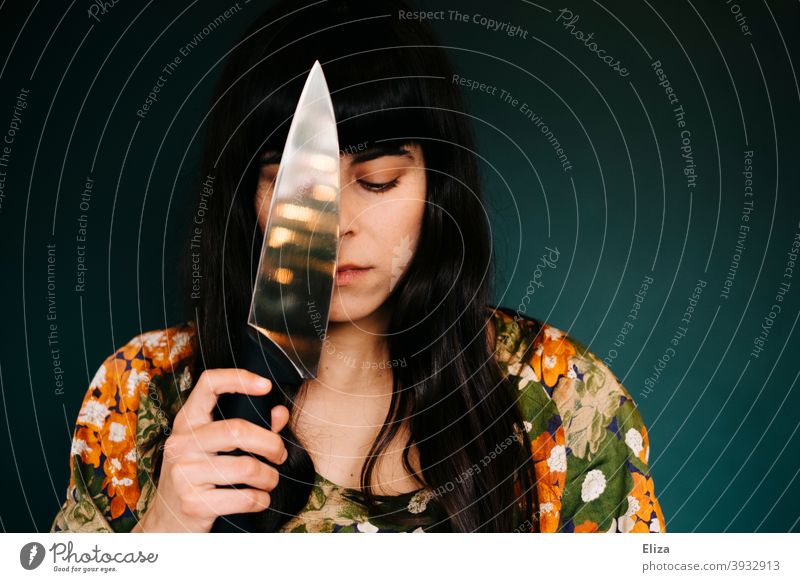 Woman with knife Knives Force suicide youthful sad desperate Problem tart Emotions in thought Melancholy Earnest depression Suicide suicidal thoughts