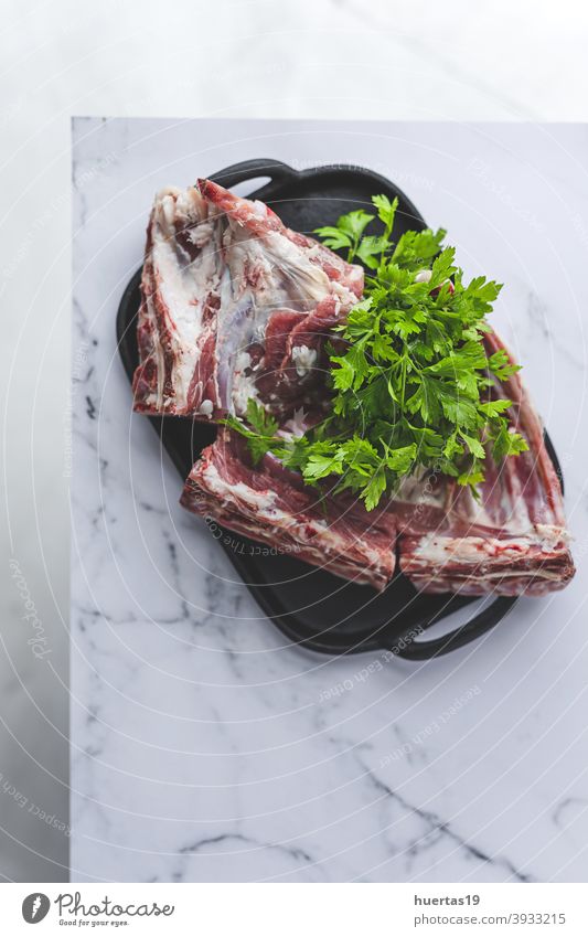 Raw rack of lamb ready to grill from above food meat raw cooking fresh red meal ribs chops cut bbq background steak uncooked table butcher preparation parsley