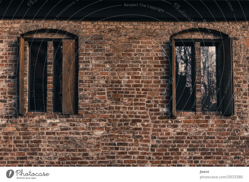 Beautiful old brick wall with symmetrical windows and wooden shutters Brick House (Residential Structure) Building Wall (barrier) Wall (building) Facade