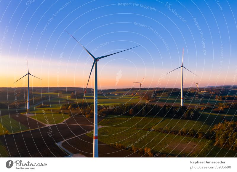 Aerial view of colorful autumn sunset at wind turbines aerial agriculture alternative blue clean construction countryside ecological ecology electric electrical