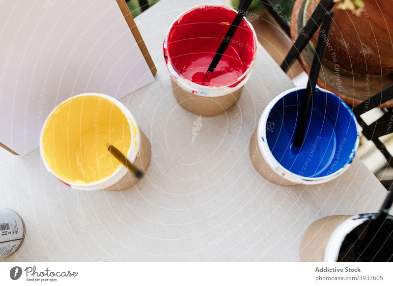 Various professional paint brushes in the jar Stock Photo by