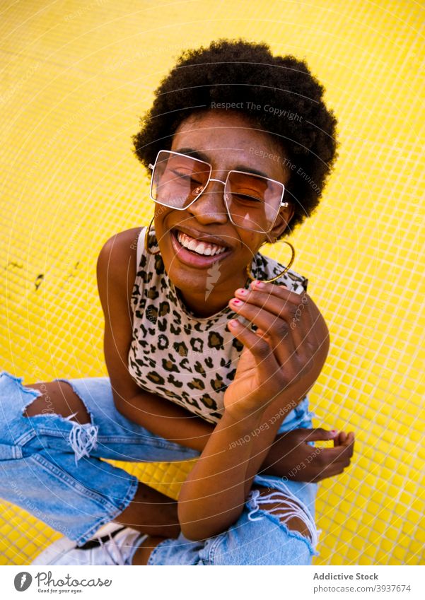 Laughing black hipster woman in stylish sunglasses style trendy cheerful laugh afro modern young female african american ethnic optimist eyewear eyeglasses