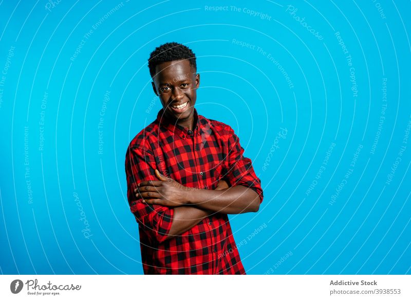 Cheerful black man in shirt in studio classic outfit cheerful handsome smile style confident male ethnic african american positive delight glad optimist white