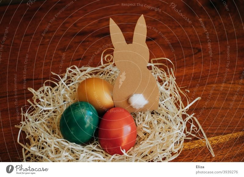 Easter nest with coloured eggs and a paper Easter bunny Easter egg nest Easter Bunny Nest colored Easter eggs variegated Decoration Home-made Easter decoration