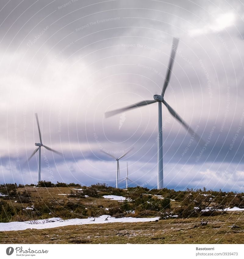 Wind turbines in the wind farm in nature, rotors in motion Wind energy plant wind power Renewable energy Energy industry Pinwheel Sky Environmental protection