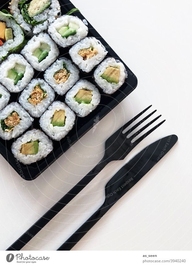 Sushi Set nigiri and sushi rolls on wooden serving board with soy sauce and  chopsticks over black stone texture background. Top view with space. Japan  menu Stock Photo