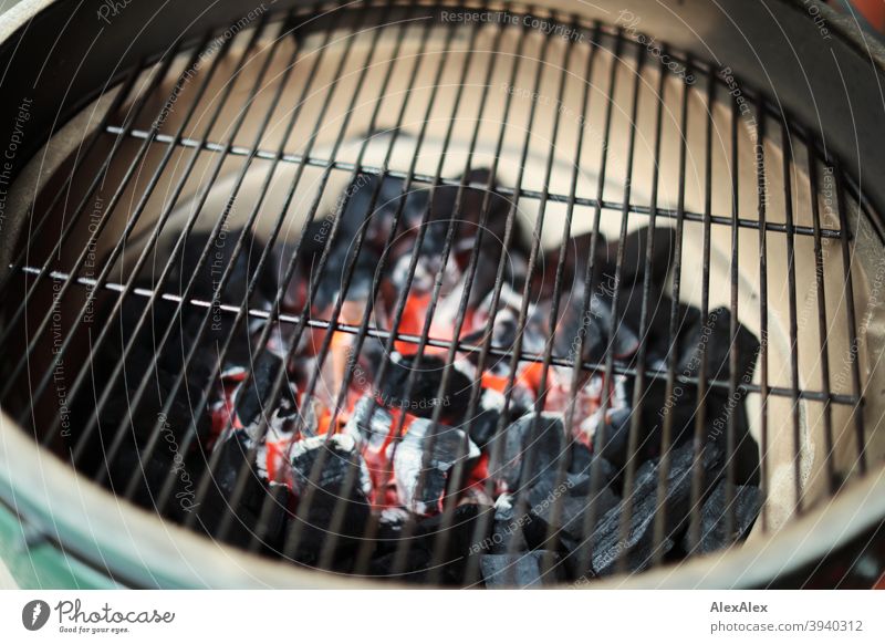 Glowing charcoal in a ceramic grill under the grill grate shortly after ignition Grill Charcoal embers grill grid Ceramic grill Kamado Kamado Grill Green