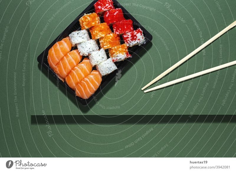 Japanese takeaway food concept. Sushi assortment to go Food Salmon Meal Fish Lunch Rice Box Asian Food Healthy Roll background Seafood Plastic Wasabi Fresh
