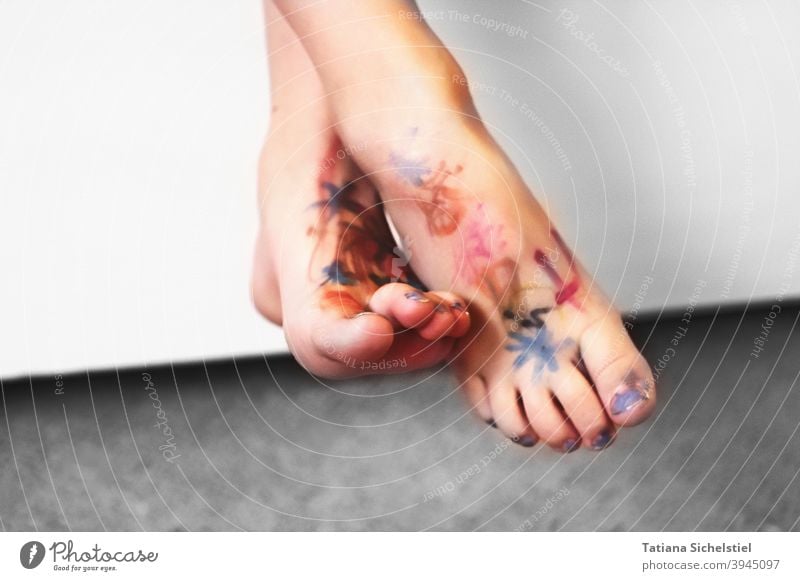 Close-up of a pair of overturned bare feet. The feet are colorfully painted with felt-tip pen. Naked Naked flesh Painted Skin variegated Body art Nail polish