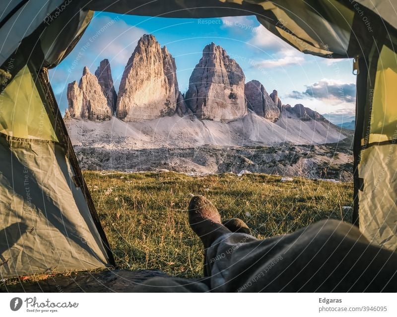 A man inside a tent in dolomites mountains, Tre cime di Lavaredo, Italy Dolomites dolomiti Tent Inside a tent Mountains tent Tre Cime di Lavaredo Hike Hiker