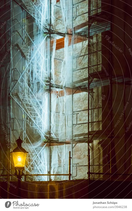 lighted scaffolding at church Scaffold Construction site Church neon tube Stairs Winter Illuminated Scaffolding Lantern Night at night Facade Deserted Building