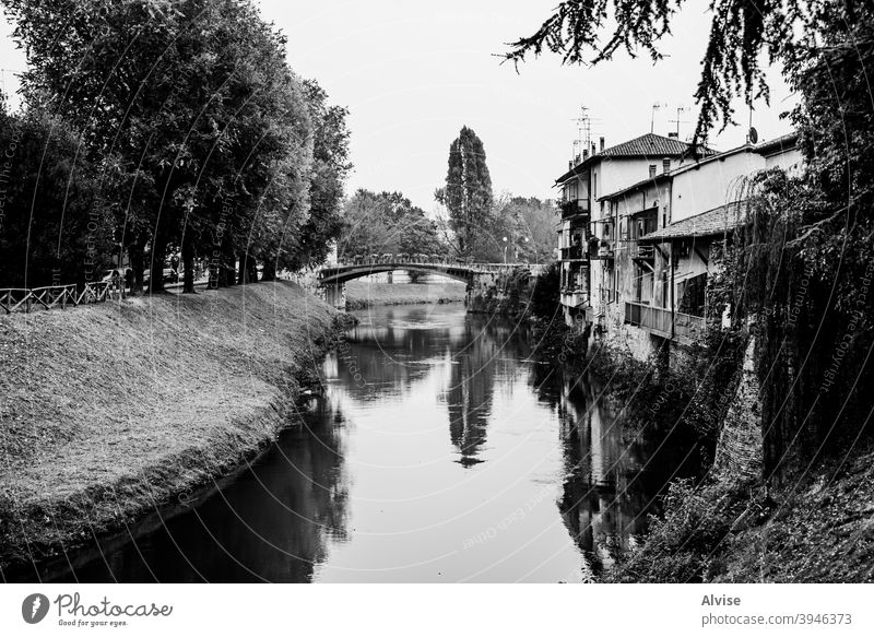 river with bridge italy water veneto vicenza bacchiglione italian city nature travel outdoor fiume green sky landscape tree blue europe grass trees background