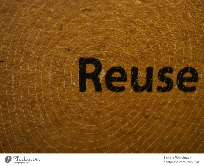 Cardboard box with the inscription "Reuse" / call for reuse sustainability Recycling Environmental protection Packaging recycle Reusable Ecological Trash