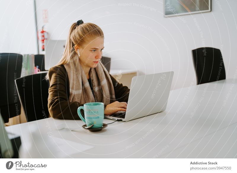 Blond Business woman working in an office business computer laptop female professional people businesswoman beautiful person manager attractive occupation young