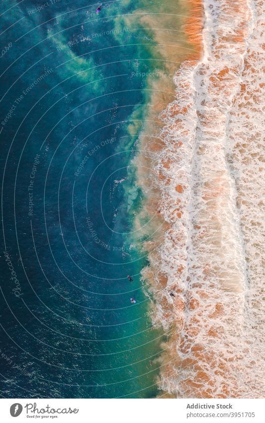 Foamy waves of rippling sea rolling on sandy coast in sunlight ocean beach nature landscape foam seashore spectacular coastline australia sunny turquoise