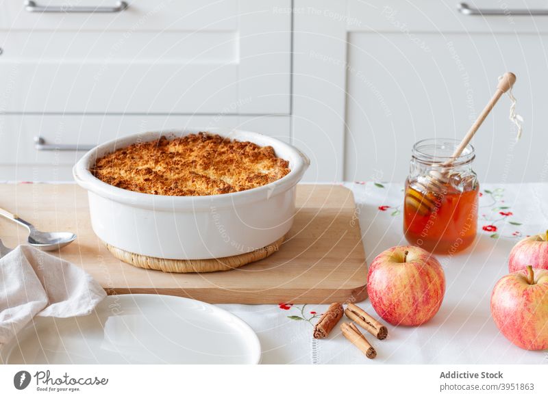 Fresh ingredients and apple crumble on table kitchen home dessert honey cinnamon food tasty yummy homemade fresh sweet baked snack pan recipe meal pastry