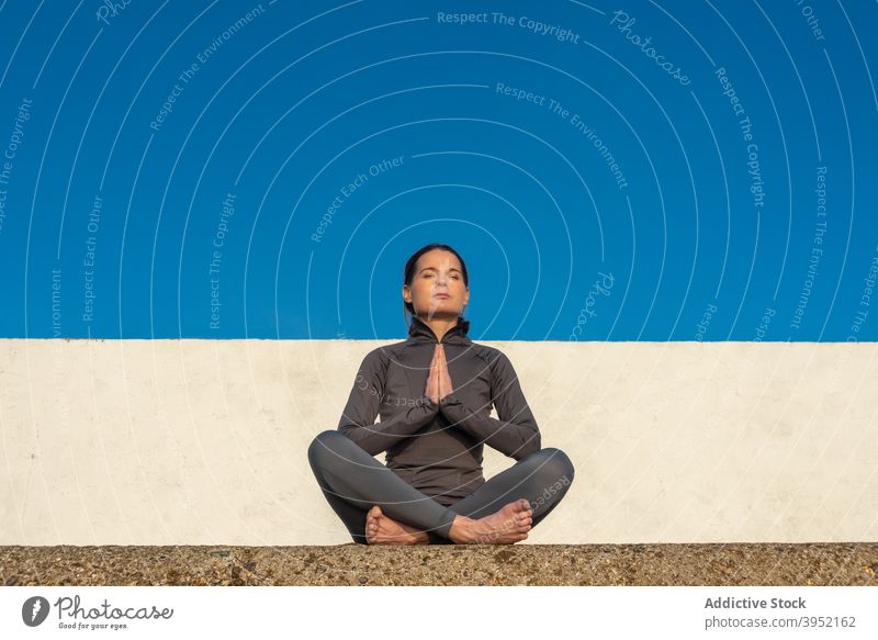 Barefoot girl doing meditation in cozy room at home - a Royalty Free Stock  Photo from Photocase