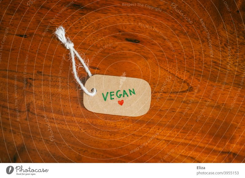 A label with the word vegan written on it. Vegan lifestyle. vegan lifestyle vegan products Shopping Consumption Products Label commodities cruelty-free veganism