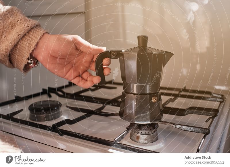 https://www.photocase.com/photos/3956552-woman-preparing-coffee-on-stove-geyser-woman-photocase-stock-photo-large.jpeg