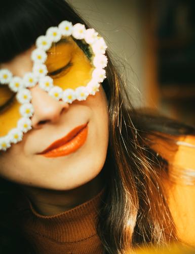 Woman with flower sunglasses in the sunlight. Retro mood, optimism, good mood and summer. Sunglasses Optimism summer atmosphere Spring sunshine little flowers