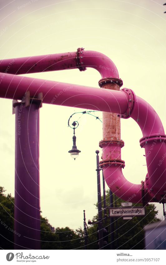 Berlin tapeworm in pink - exposed and bending with laughter - decorates with nostalgic streetlamp reeds Water pipes pipe system Pink Groundwater