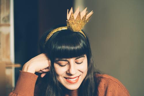 Smiling woman with golden crown on her head. Crown Woman Princess Disguised Adults timid Feminine portrait cladding Carnival Human being