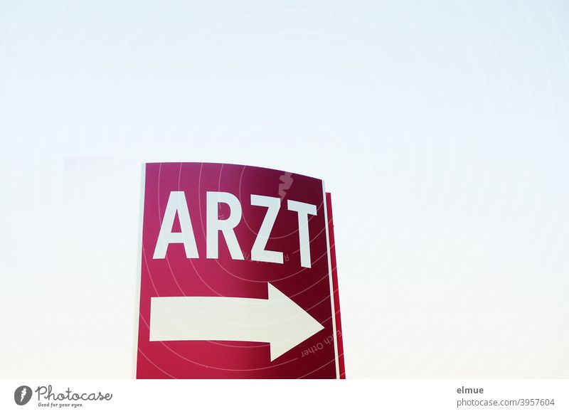 the wine-red sign says "ARZT" in white above a big white arrow / emergency / orientation Clue Signage Doctor label Arrow White Help Signs and labeling